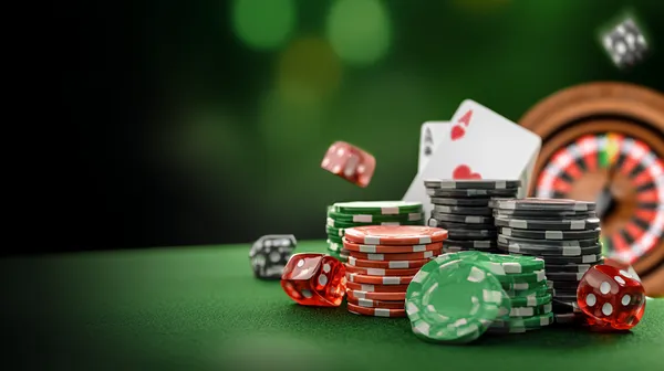 26JL Casino Games — Enjoy nonstop entertainment A close-up shot of golden coins falling around a spinning roulette wheel, representing immersive casino action at 26JL.