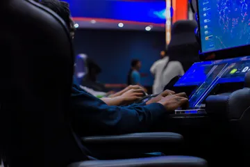 A laptop glowing with a bright login prompt in a minimalistic setup, symbolizing the protected access system at 26JL.